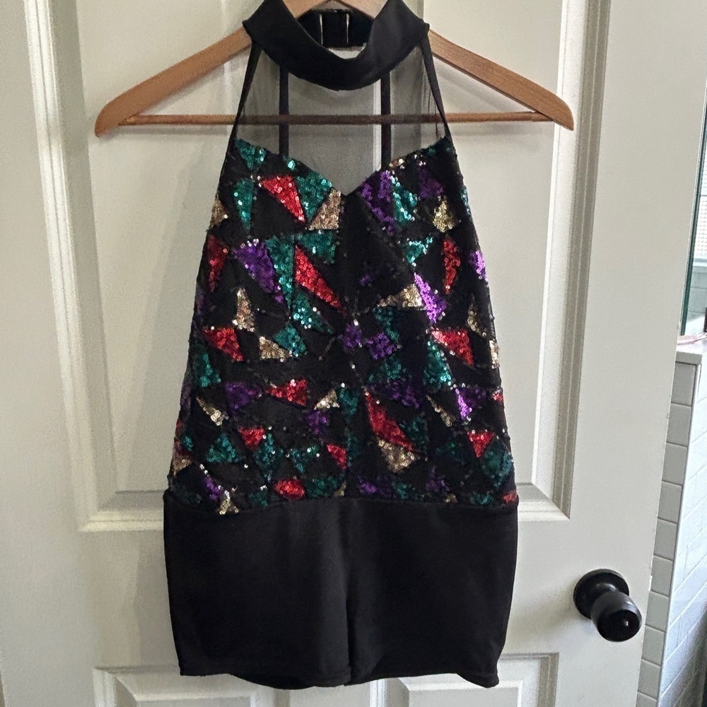 Like new XL girl’s 3 piece dance costume. Halter  leotard with  short & 2 skirts